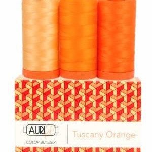 May include: Three spools of Aurifil thread in shades of orange, labeled "Tuscany Orange" and "Color Builder".