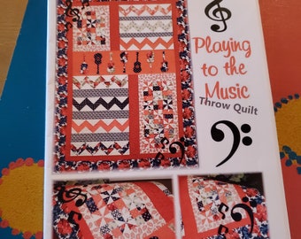 The ribbon retreat playing to the music throw quilt