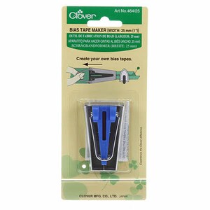 May include: Clover Bias Tape Maker, a tool for creating bias tape, with a blue plastic guide and a metal frame. The tool is 1 inch wide and is labeled "Cutting the fabric into strips".