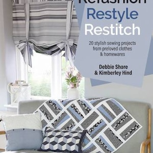 May include: A book titled "Refashion Restyle Restitch" with a blue and white patterned fabric on the cover. The book cover also features the text "20 stylish sewing projects from preloved clothes & homewares" and "Debbie Shore & Kimberley Hind".