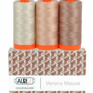 May include: Three spools of thread in shades of beige, light brown, and brown, labeled "Verona Mauve" and "Color Builder" on a box with a geometric pattern.