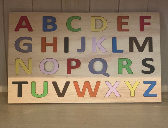 wooden alphabet puzzle board