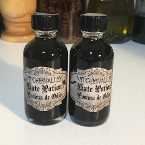 May include: Two small black glass bottles with black screw-top lids. Each bottle has a white label with black text that reads "Witchesvalley Hate Potion Posima de Odio".