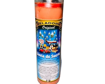 May include: A red and orange glass candle with a blue label that says "Veladora Original" and "Juvia de Suerte". The label has images of a house, a car, a plane, money, and four-leaf clovers.