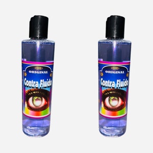 May include: Two clear glass bottles with blue liquid and black caps. The bottles have a label with the text "ORIGINAL Contra Fluido" and a colorful image of an eye.