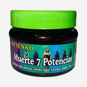 May include: A jar of incense with a green lid and a label featuring the words "INCIENSO Muerte 7 Potencias." The label also displays images of hooded figures with scythes. The jar is filled with a dark, solid substance.