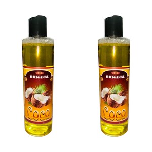 May include: Two clear glass bottles with yellow liquid and black caps. The bottles have labels with the words "ORIGINAL" and "Coco" in brown text. The labels also feature a graphic of coconuts.