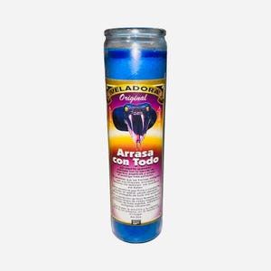 May include: A tall, cylindrical blue candle with a label featuring a snake illustration and the words "VELADORA Original Arrasa con Todo." The candle has a blue top and base, with a yellow and purple gradient in the middle.