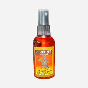 May include: A perfume bottle with a clear cap and a black spray nozzle. The bottle contains a reddish-orange liquid and has a label with the words "PERFUME Original" and a colorful illustration of a figure. The word "Retro" is also on the label.