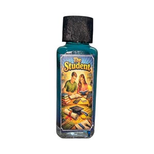 May include: A teal-colored glass bottle with a black cap. The label features the text "The Student" above an illustration of two students studying. The bottle contains a liquid and is likely a fragrance or essential oil.