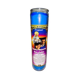 May include: A blue glass candle with a label that reads "Veladora Original Santa Muerte Del Odio". The label features an image of a woman in a white robe, a man in a black suit, and a woman with her hand over her eyes. The label also includes a prayer in Spanish.