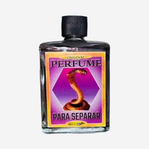 May include: A rectangular glass perfume bottle with a black cap. The label features the word "PERFUME" above a graphic of a cobra. The words "PARA SEPARAR" are below the cobra graphic. The label has a purple and orange color scheme.