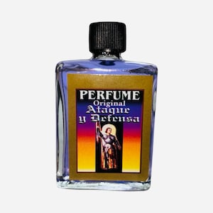 May include: A small glass bottle with a black cap containing a purple liquid. The label reads "PERFUME Original Ataque y Defensa" and features a colorful image of a person in armor.