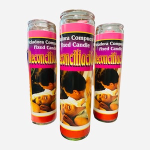 May include: Three pink and purple glass candle jars with a couple embracing on the front. The text on the jars reads "Veladora Compuesta Fixed Candle Reconciliacion".