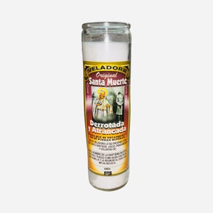 May include: A tall, cylindrical glass candle with a white wax interior. The candle has a yellow and red label with the words "Veladora Original Santa Muerte" and an image of a saint. The label also includes Spanish text. The candle is designed for spiritual use.