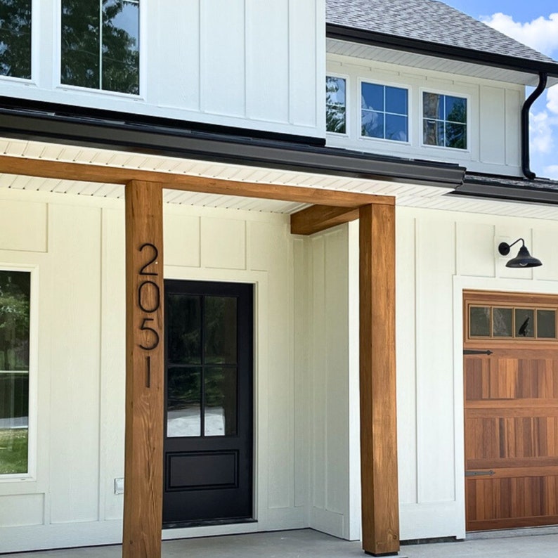 8 inch THIN MODERN house numbers on Modern Farmhouse with white siding, black trim and cedar details