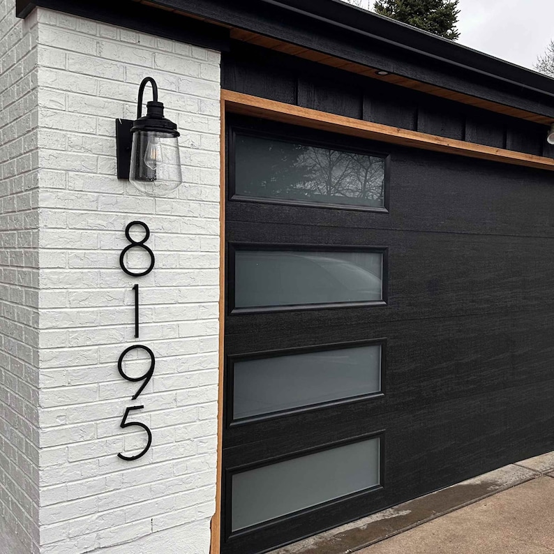 Easy to install house numbers for a unique address sign. THIN MODERN house numbers and letters for offices and commercial buildings. Exterior renovation and front door remodel.