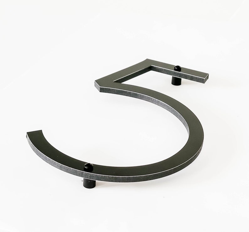 8 inch tall THIN MODERN house number 5 shown from the side and on an angle showing the spacers that help the number stand out from the siding