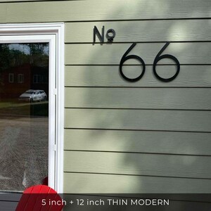 THIN MODERN 5 inch and 12 inch black address numbers No. 66 on green siding