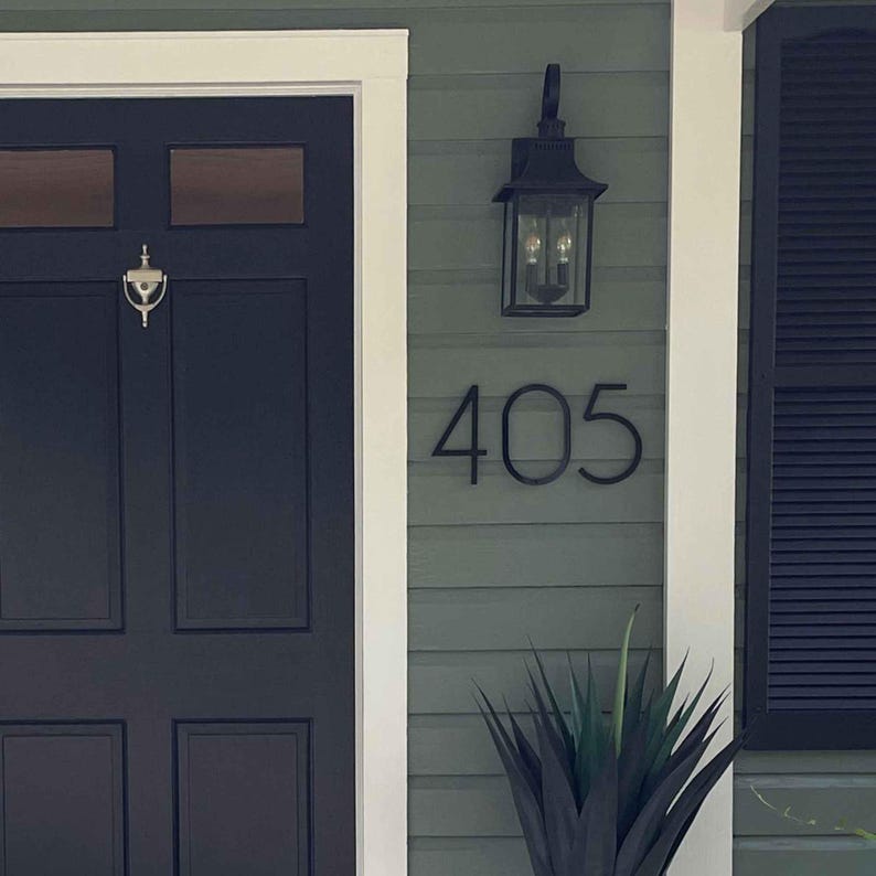 THIN MODERN 8 inch black address numbers 405 on green vinyl siding beside a black front door