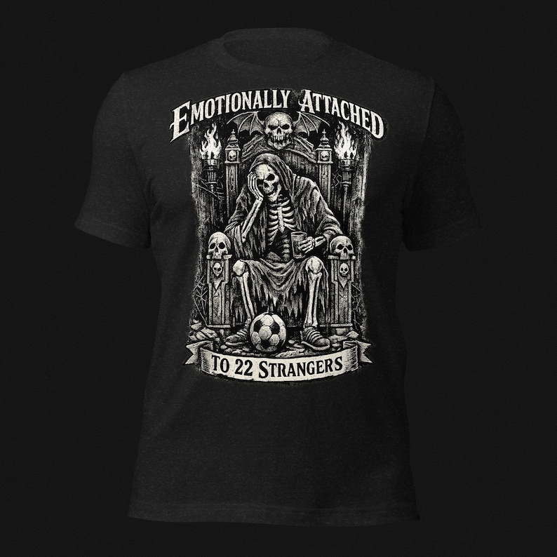 Emotionally Attached To 22 Strangers gothic football fan shirt featuring a frustrated skeleton sitting on a throne with a soccer ball, dark humor sports tee, gothic soccer shirt, vintage skeleton artwork, football lover gift, alternative fashion, dark academia style, soccer supporter apparel, unique football fan clothing, match day shirt, gothic sports design, unisex football t shirt.