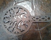 Vintage Wilton cast iron trivet