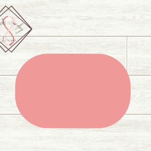 May include: A light pink oval shape on a white woodgrain background.