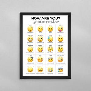 May include: A framed wall poster featuring a grid of twenty yellow emojis representing various emotions. Each emoji is labeled in both English and Spanish, with the title HOW ARE YOU? ¿CÓMO ESTÁS? printed in black at the top of the white background.