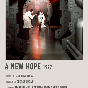 May include: A movie poster for the film "A New Hope" (1977) from the Star Wars franchise. The poster features a scene from the film with Princess Leia and R2-D2 in a dark, metallic hallway.