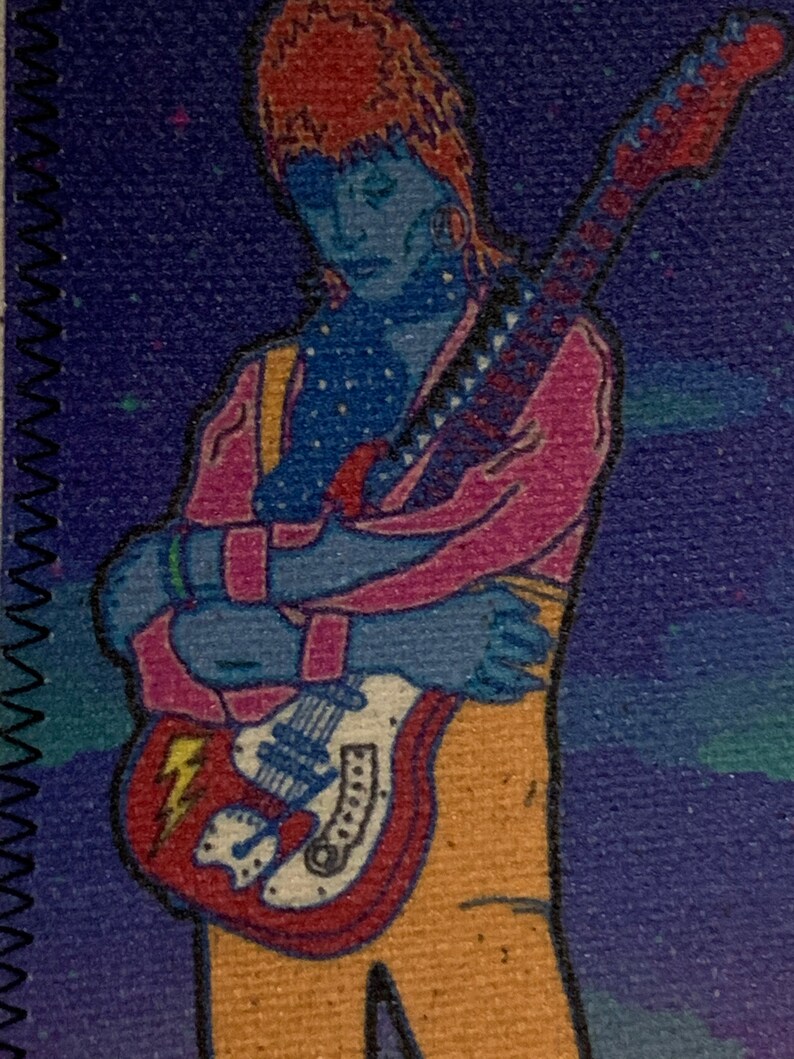 May include: A colorful illustration of a figure with blue skin, wearing a pink jacket and orange pants, holding a red and white electric guitar. The background is a dark blue with white specks.