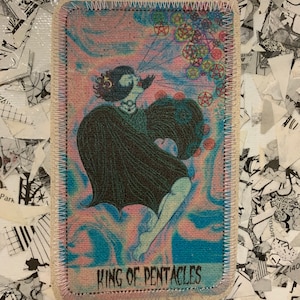 May include: Rectangular patch featuring the King of Pentacles tarot card. The illustration depicts a figure in a dark cloak with a swirling blue and pink background. The text "KING OF PENTACLES" is at the bottom. The patch has a white stitched border.