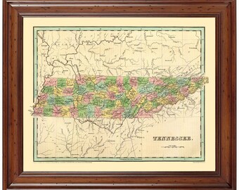 May include: A vintage map of Tennessee, printed in shades of green, yellow, pink, and brown. The map shows the state's counties and major rivers. The title "TENNESSEE." is printed at the bottom of the map.