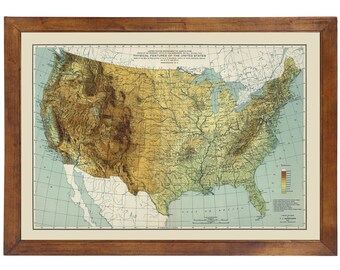 May include: A vintage map of the physical features of the United States, showing elevation and river systems. The map is framed in a brown wooden frame and has a color key to indicate elevation.