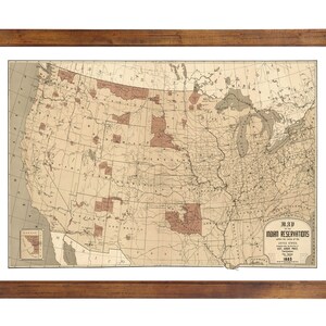May include: A vintage map of the United States showing the locations of Indian Reservations in 1883. The map is framed in a brown wooden frame.