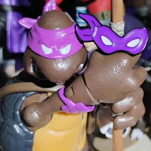 Penguin Random House Exclusive: TMNT 40th Anniversary Comics Celebration—The Deluxe Edition , official &#39;DONATELLO&#39; banana Enamel pin 2024