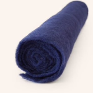May include: A roll of dark blue felt fabric.