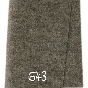 May include: A brown felt sheet with the number 643 written in white on it.