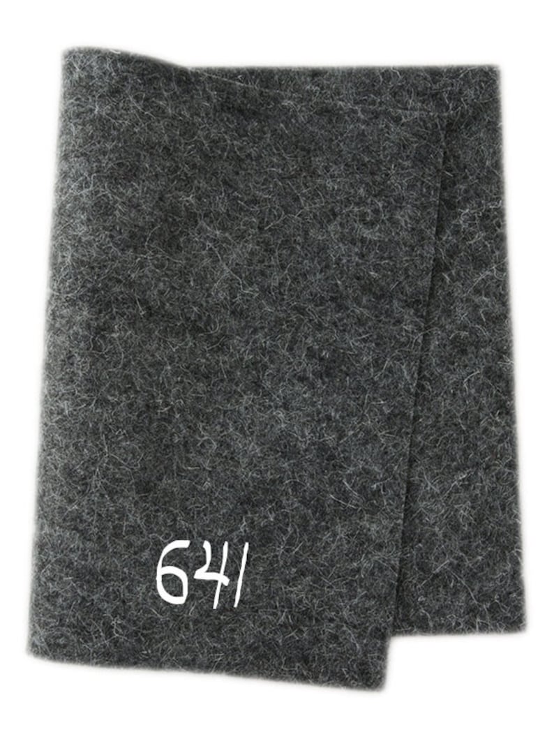 May include: A dark grey felt fabric with the number 624 printed in white.