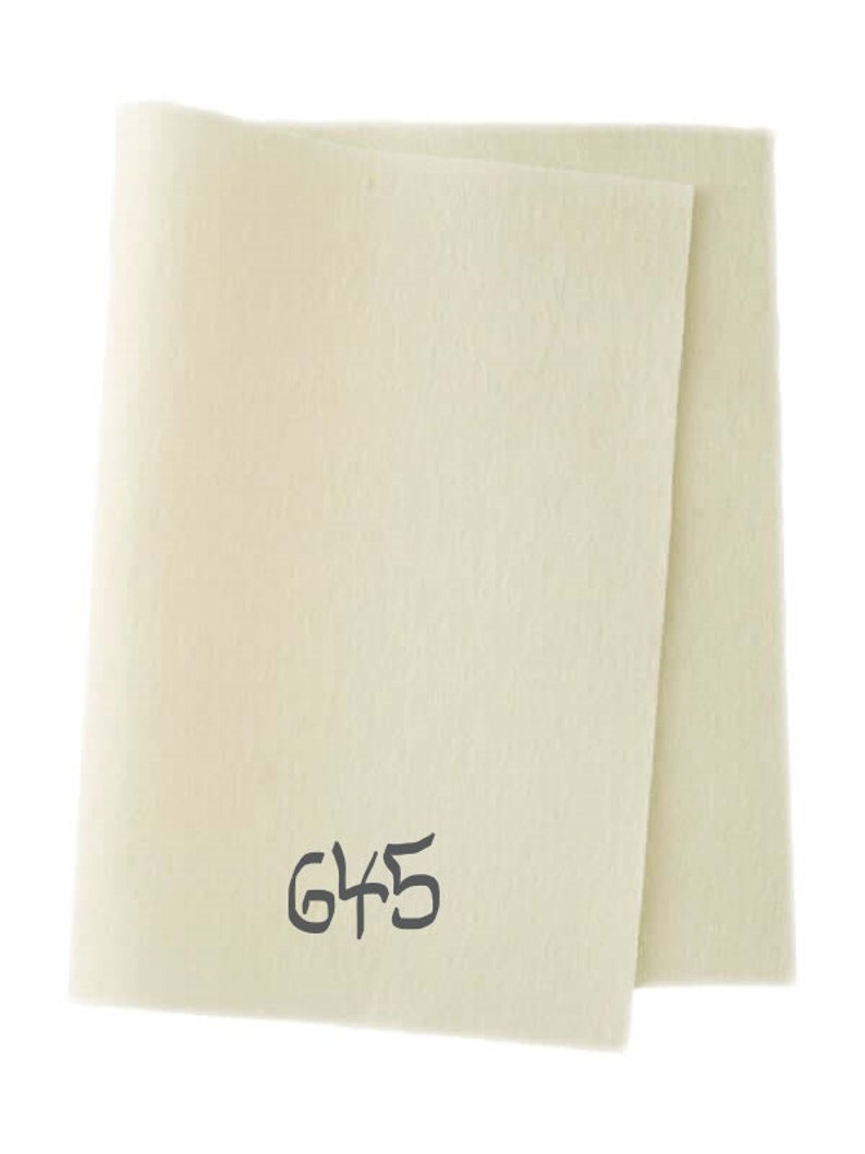 May include: A sheet of white felt with the number 645 printed on it.