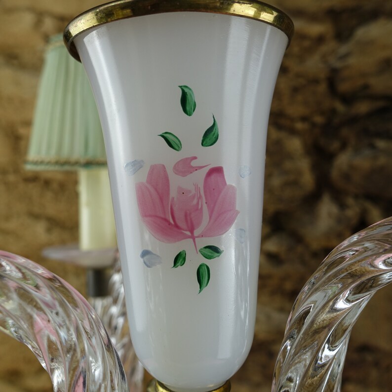 May include: A white glass lampshade with a gold rim and a hand-painted pink rose with green leaves.
