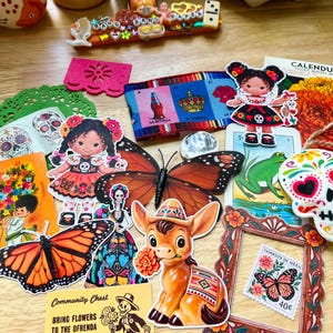 May include: A collection of colorful paper ephemera including stickers of a donkey, monarch butterflies, and dolls in traditional attire, a yellow Community Chest card with text, a Mexican lottery card, a floral frame, and a postage stamp.