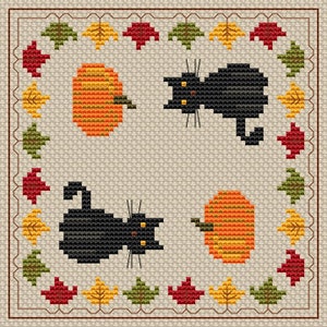 May include: Cross-stitch design with two black cats and two orange pumpkins. The design is framed by a border of autumn leaves in red, yellow, and green. The background is a light beige colour.