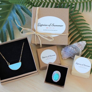 May include: Three small gift boxes with turquoise jewelry inside. Each box has a white label with the text "Gypsies of Summer" and the words "jewelry for the free spirit".