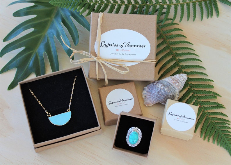 May include: Three small gift boxes with turquoise jewelry inside. Each box has a white label with the text "Gypsies of Summer" and the words "jewelry for the free spirit".