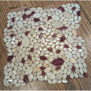 May include: A square mosaic tile sheet featuring a dense pattern of leaf-shaped pieces in varying shades of cream, beige, and deep burgundy. The individual leaf tiles have a smooth, polished finish and are arranged in an organic, overlapping layout.