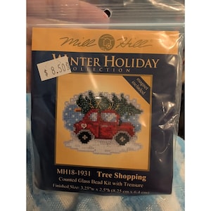 May include: A Mill Hill Winter Holiday Collection counted glass bead kit titled Tree Shopping, model MH18-1931. The package features a cross-stitch design of a red car carrying a Christmas tree, with a finished size of 3.25 inches by 2.5 inches.