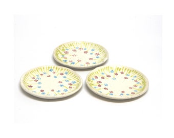 Set of 3 small handmade ceramic decorative plates with soft freehand colored flower drawings. Home gift.