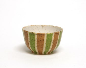 Small ceramic bowl with green and honey-brown stripes. White dotted material. Handmade gift.