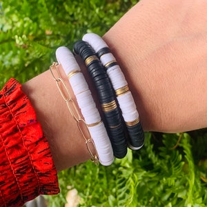 Black and white stack with gold discs, heishi beads, stack of bracelets