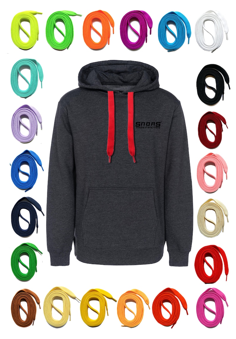 May include: A dark gray hoodie with red drawstrings, and the text "Snoas ShoeFriends" in black. Surrounding the hoodie are various colored shoelaces, including green, orange, purple, blue, white, black, and pink.